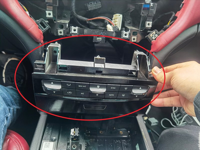 15. Take out the CD host of the original vehicle and install the additional air conditioning panel back to its original position